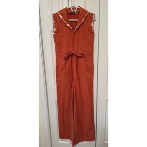 Patty O’Neil orange cream jumpsuit